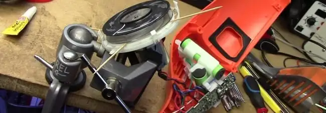 Vacuum cleaner repair parts and tools on a workbench in Scottsdale, AZ