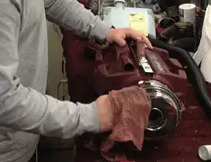 Vacuum repair technician cleaning and servicing a vacuum motor in Scottsdale, AZ